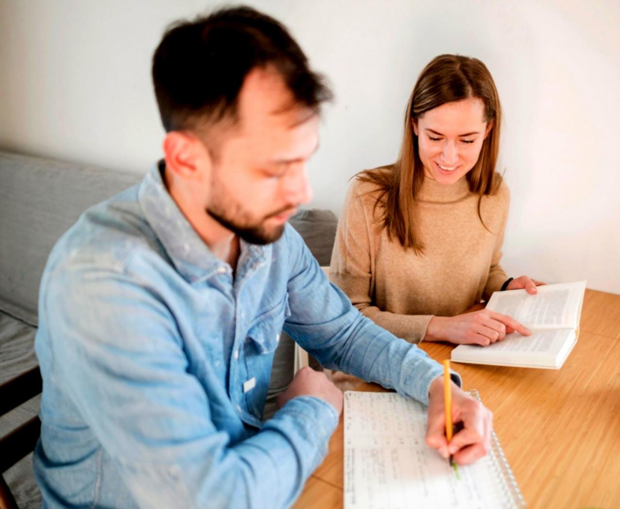 Financial education workshop session with participants engaged in practical business learning activities